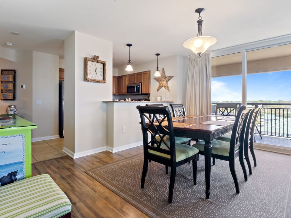 Enjoy meals together in your open dining area with scenic balcony views creating the perfect backdrop for memorable conversations.
