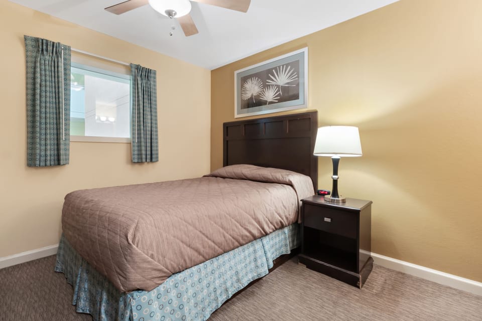 Unwind in your cozy bedroom featuring warm earth tones, a comfortable bed, and gentle natural light.