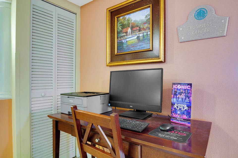 This designated business center offers a quiet workspace with a computer, printer, and comfortable seating—perfect for handling emails or planning your next adventure.