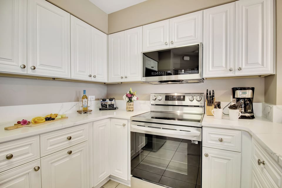 Your bright, fully-equipped kitchen awaits with stainless appliances, ample storage, and everything needed for home cooking.