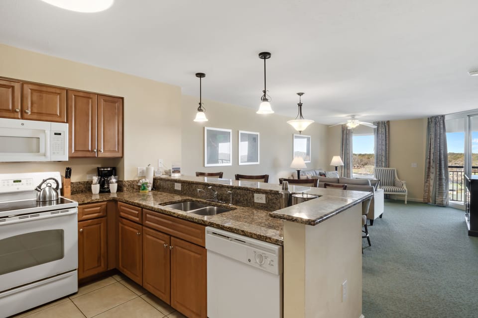 Your spacious kitchen flows seamlessly into the living area, perfect for preparing meals while staying connected with everyone.