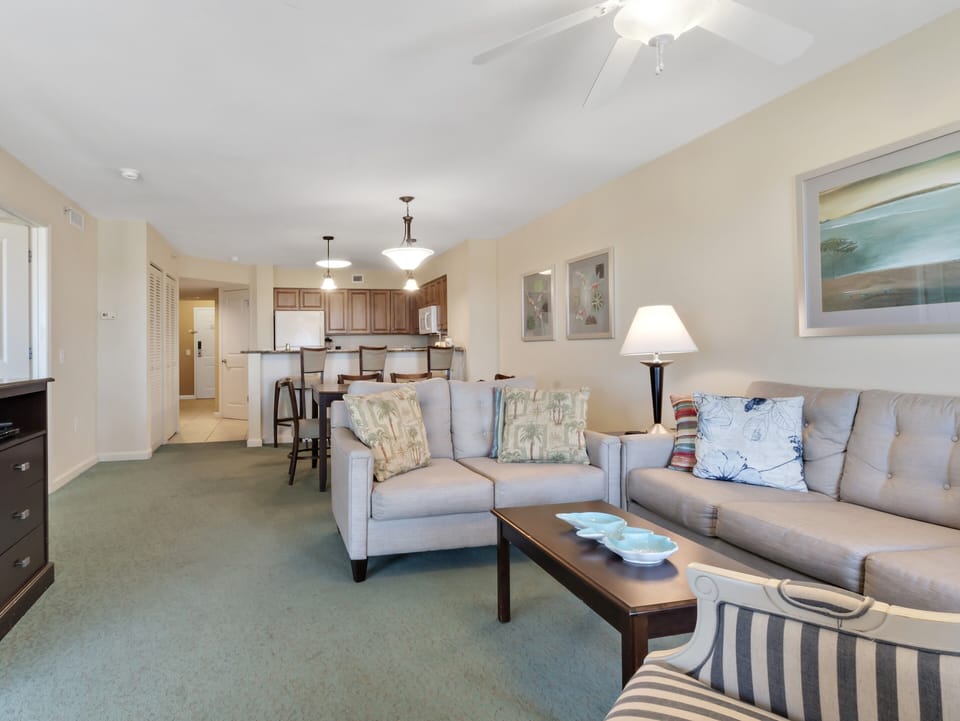 Relax in your spacious living area with comfortable seating, perfect for unwinding after exploring nearby attractions.