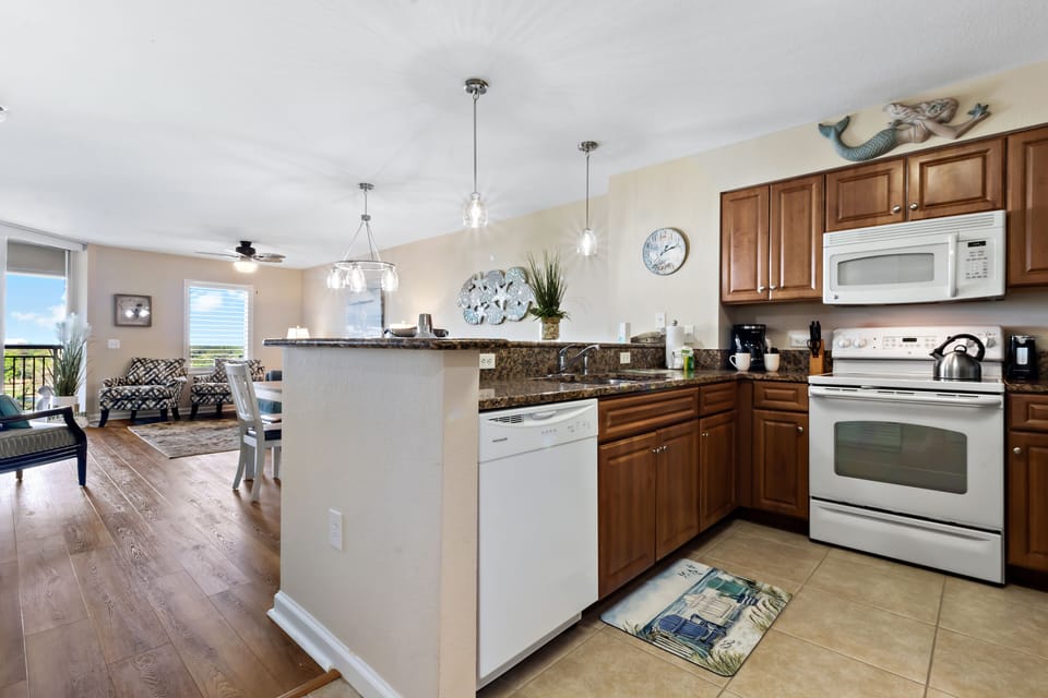 You'll love cooking in your fully-equipped kitchen with granite counters, plus the open layout connects you to guests in the living room.