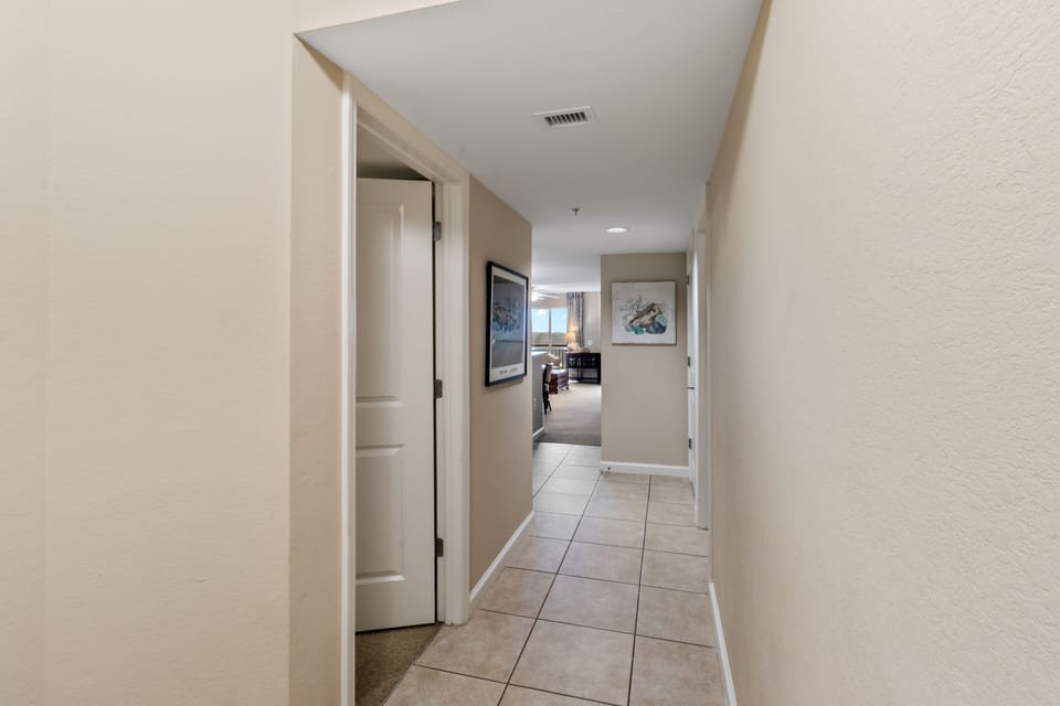 Walk through your private hallway with convenient access to all rooms and beautiful artwork adorning the walls.
