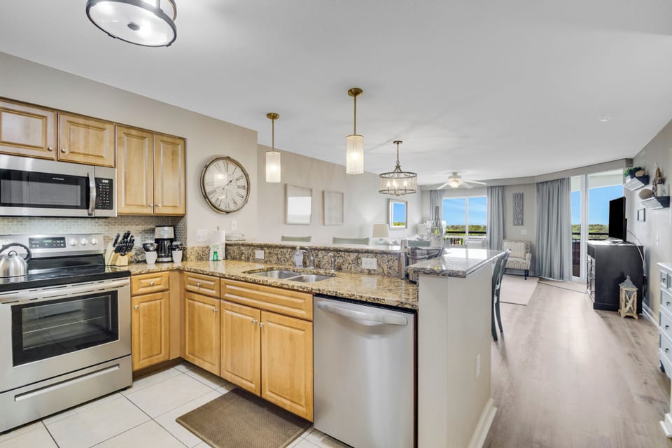 Your fully equipped kitchen flows seamlessly into the living space, perfect for preparing meals while staying connected with family.