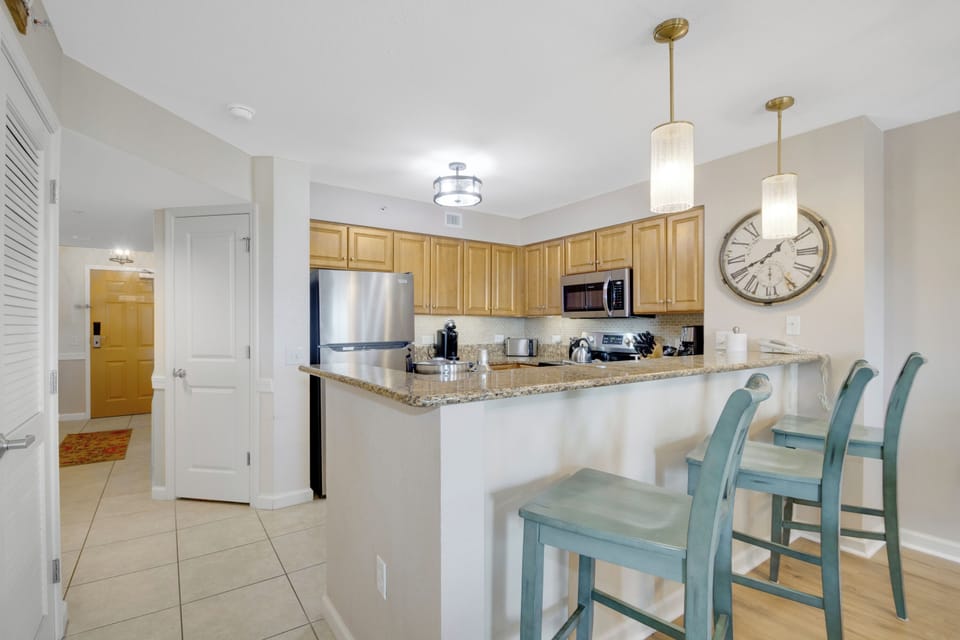Your modern kitchen awaits with granite countertops, stainless steel appliances, and a stylish breakfast bar for morning coffee.