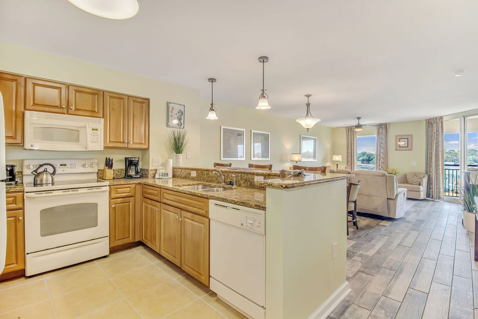 Your open-concept kitchen features granite countertops and flows seamlessly into the living area, perfect for entertaining.