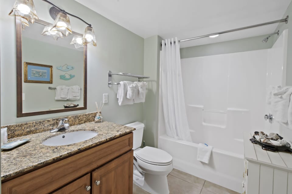 Your private bathroom features granite countertops, fresh towels, and a relaxing tub-shower combo for unwinding after your adventures.