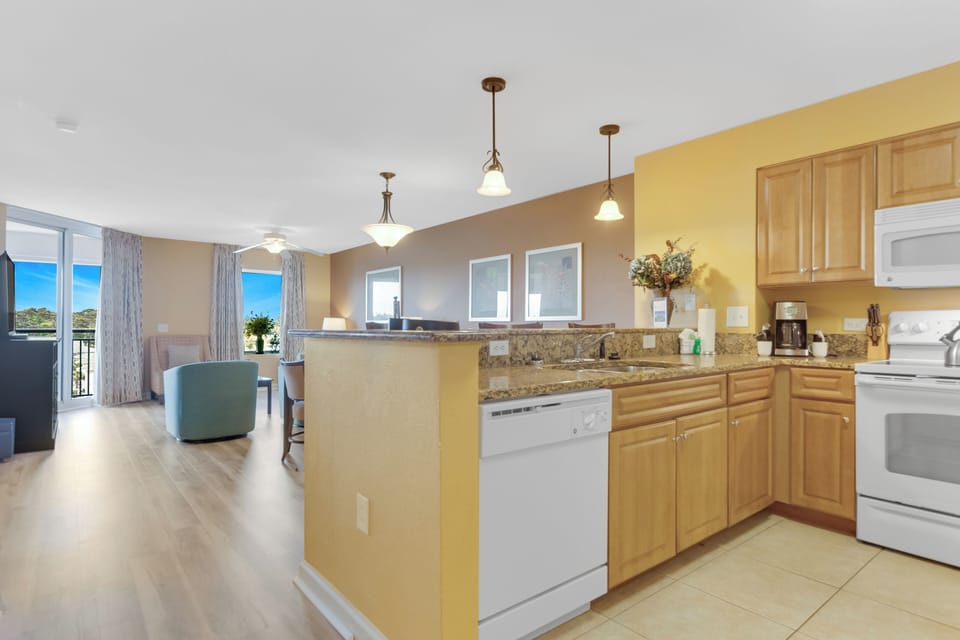 Your fully equipped kitchen flows seamlessly into the open living space, perfect for preparing meals while enjoying ocean views.