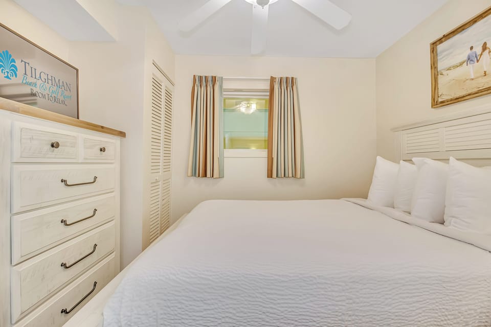 Sink into crisp white linens and wake refreshed in your bright bedroom with coastal charm and ample storage for all your belongings.
