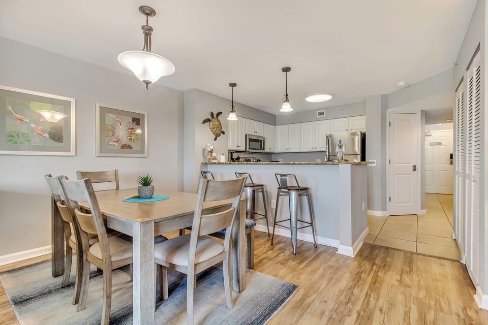 Gather around your spacious dining table for memorable meals, then chat at the sleek breakfast bar in this beautifully appointed open-concept space.