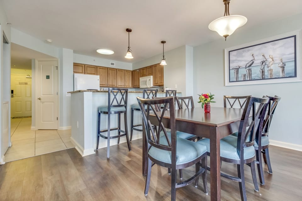 Gather around your spacious dining table for memorable meals, with a fully equipped kitchen and breakfast bar perfect for morning coffee.