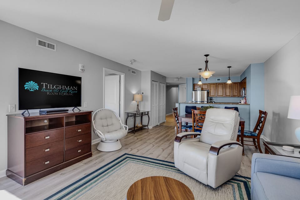 Your spacious open-plan living area flows seamlessly into a fully equipped kitchen, perfect for relaxing after beach days.
