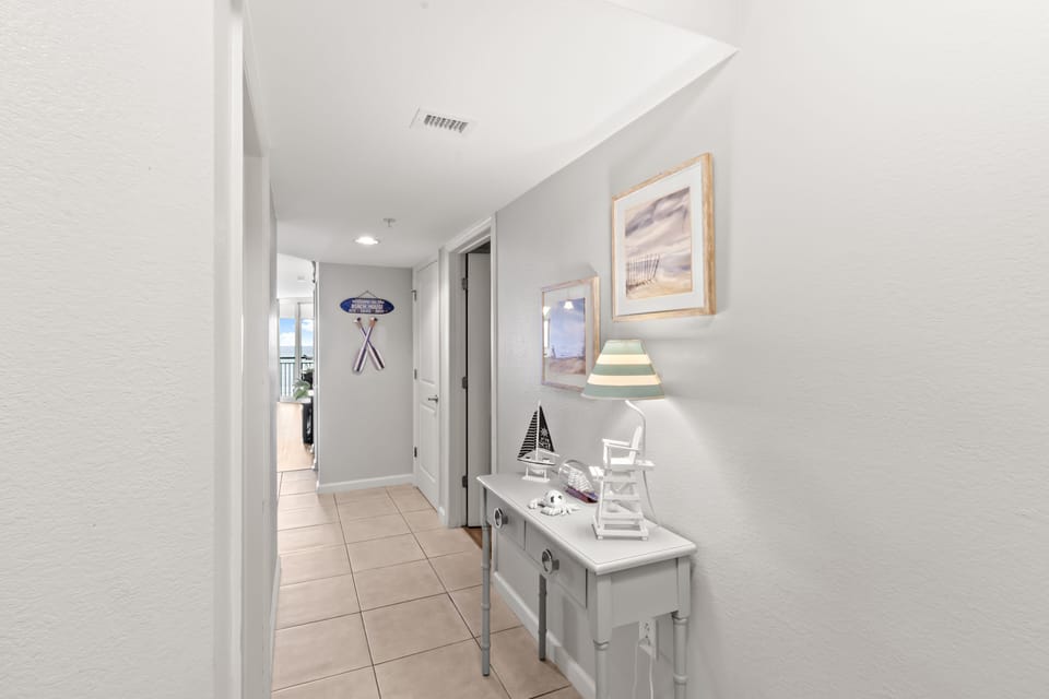 You'll love this bright hallway with coastal decor and charming nautical touches that welcome you home.
