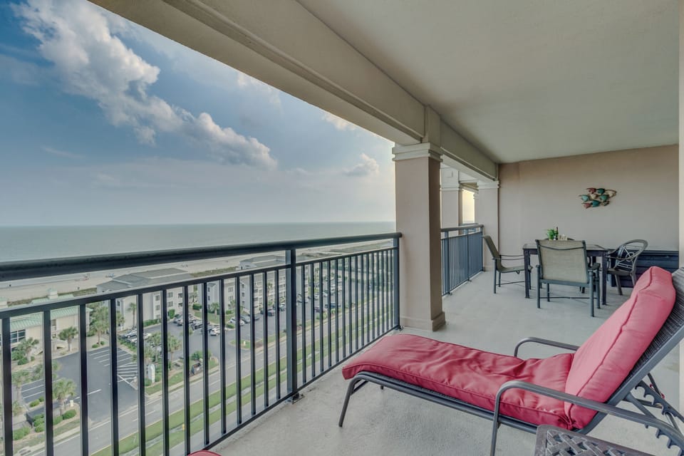 Spectacular oceanfront balcony with sweeping sea views where you can unwind in comfortable seating while watching the waves below.