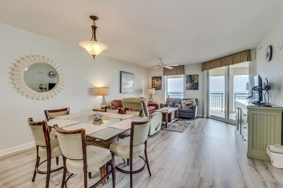 Step into your bright, open living space where elegant dining meets beachfront comfort, perfect for sharing meals while enjoying ocean views.