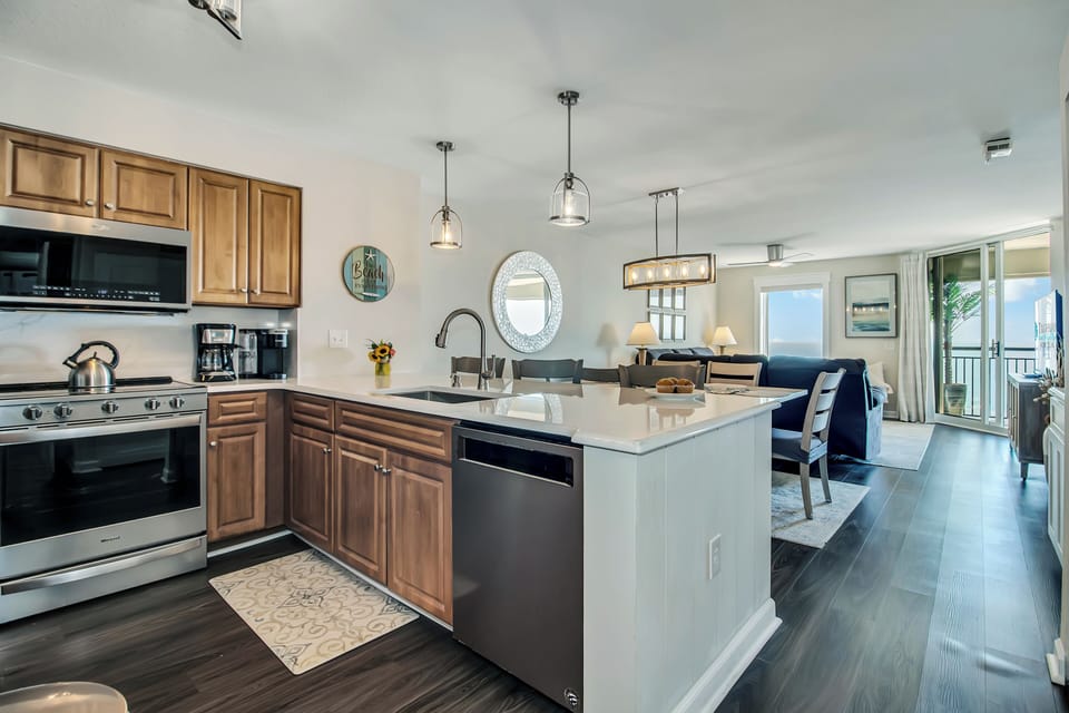 Your fully equipped kitchen flows seamlessly into the living area, perfect for preparing meals while staying connected with family.