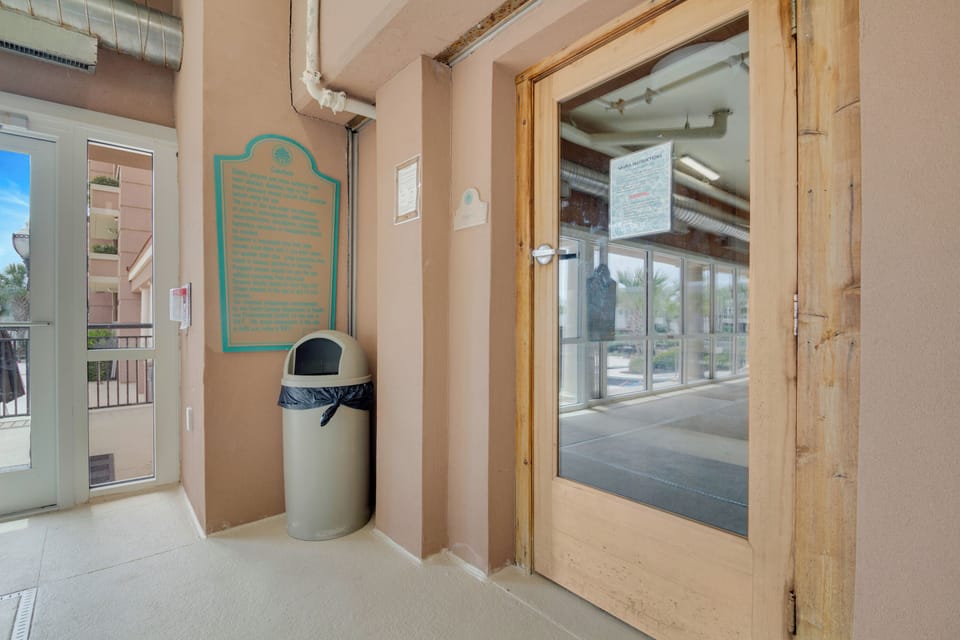 The property entrance features a covered walkway with direct street access and a historical marker noting the area's heritage.