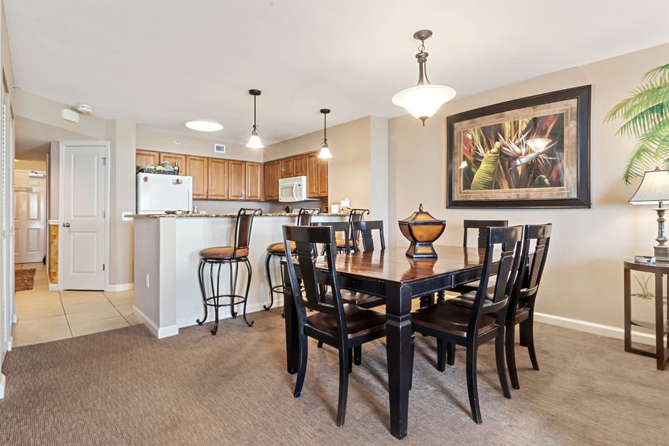 Your open dining area flows seamlessly into the fully equipped kitchen, perfect for hosting memorable meals with family and friends.