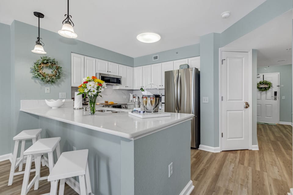 Your bright kitchen features modern appliances and a spacious island for cooking memorable meals together.