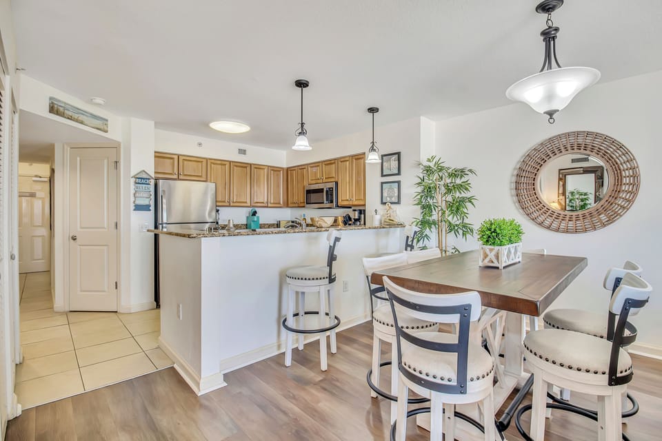 Your open kitchen and dining space features granite counters, modern appliances, and stylish seating where you can gather for meals.