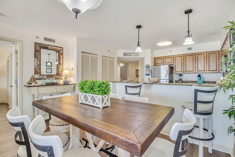 Gather around your spacious dining table where morning coffee flows into evening conversations, all while the open kitchen invites you to create memorable meals together.