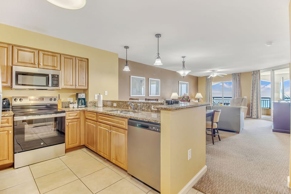 Your fully equipped kitchen flows seamlessly into the dining and living areas, perfect for preparing meals while staying connected with everyone.