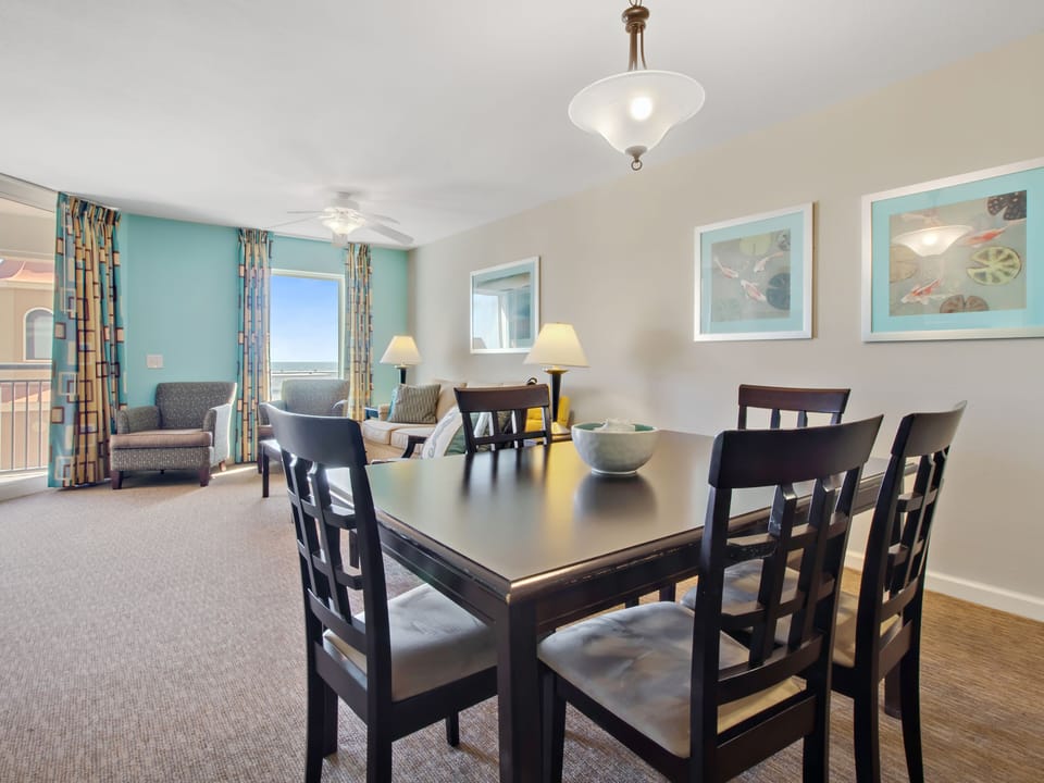 Gather around your elegant dining table for memorable meals while enjoying ocean views through your bright windows.