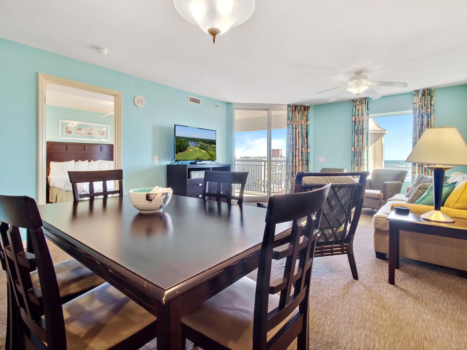 Your bright oceanfront suite features a spacious dining area and comfortable living room, perfect for family meals and relaxing evenings.