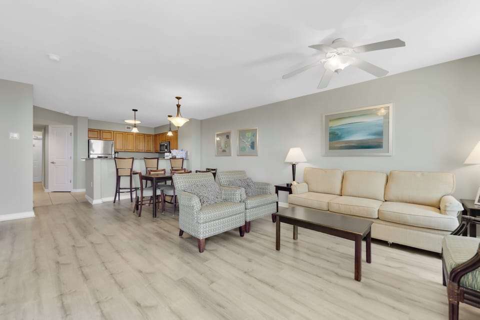 Relax in your spacious open-concept living space with comfortable seating, modern kitchen, and dining area for memorable vacation meals.