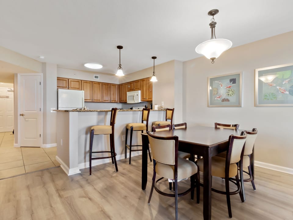 Your spacious dining area flows seamlessly into the fully-equipped kitchen, perfect for sharing memorable meals together.