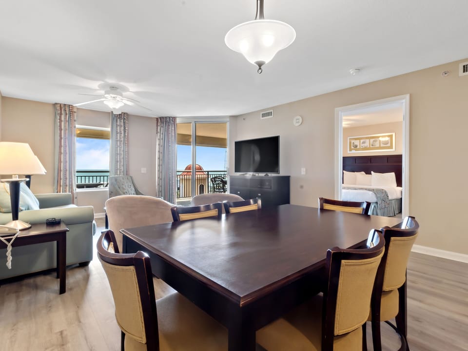 Your elegant suite offers ocean views and spacious comfort with a dining table for memorable meals together.