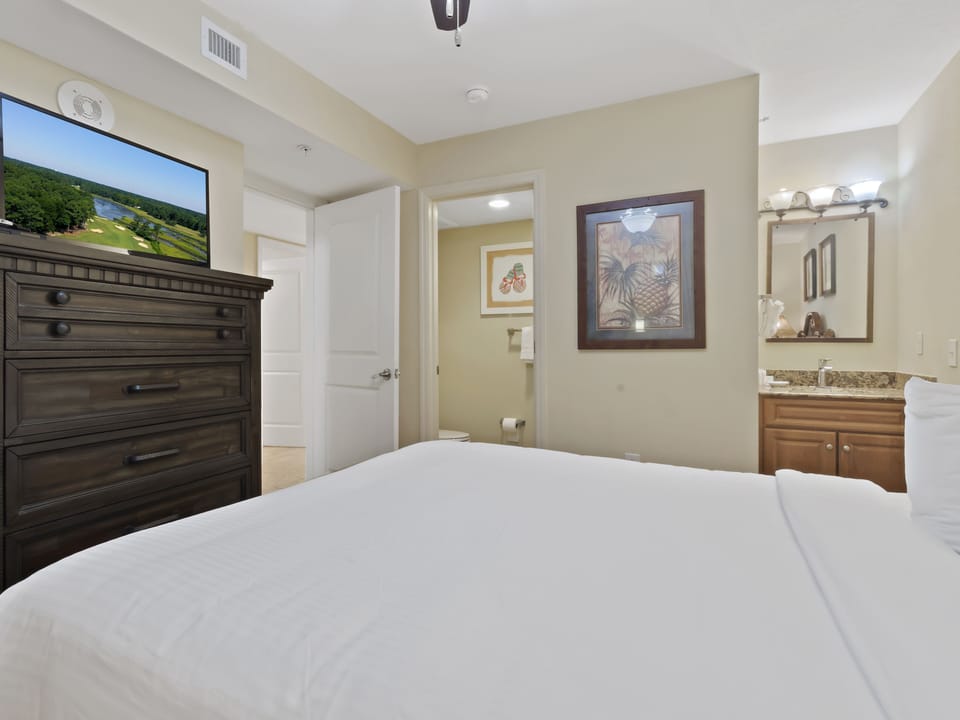 Sink into crisp white linens while your private bathroom awaits just steps away, complete with granite countertops and thoughtful touches.