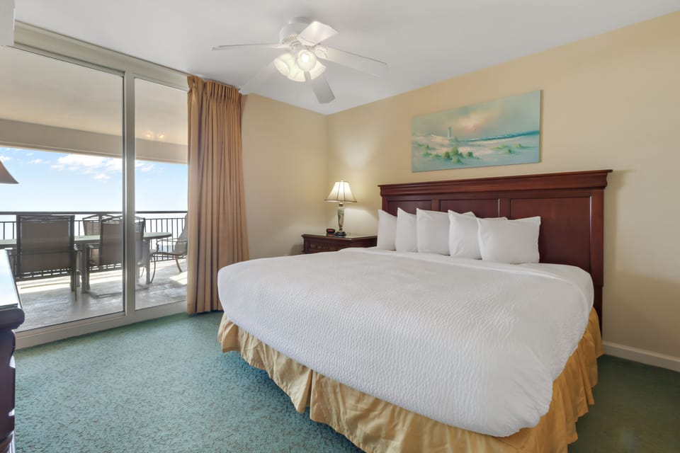 Wake up to ocean breezes in your serene bedroom featuring crisp linens and private balcony access for morning coffee with a view.
