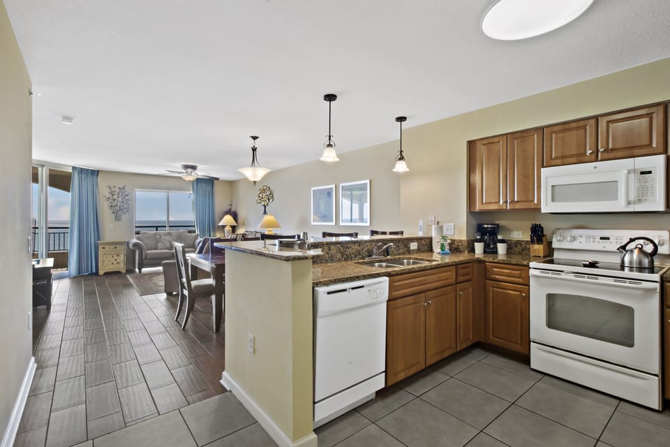 Your open-concept kitchen flows seamlessly into the living space, fully equipped for memorable meals together.