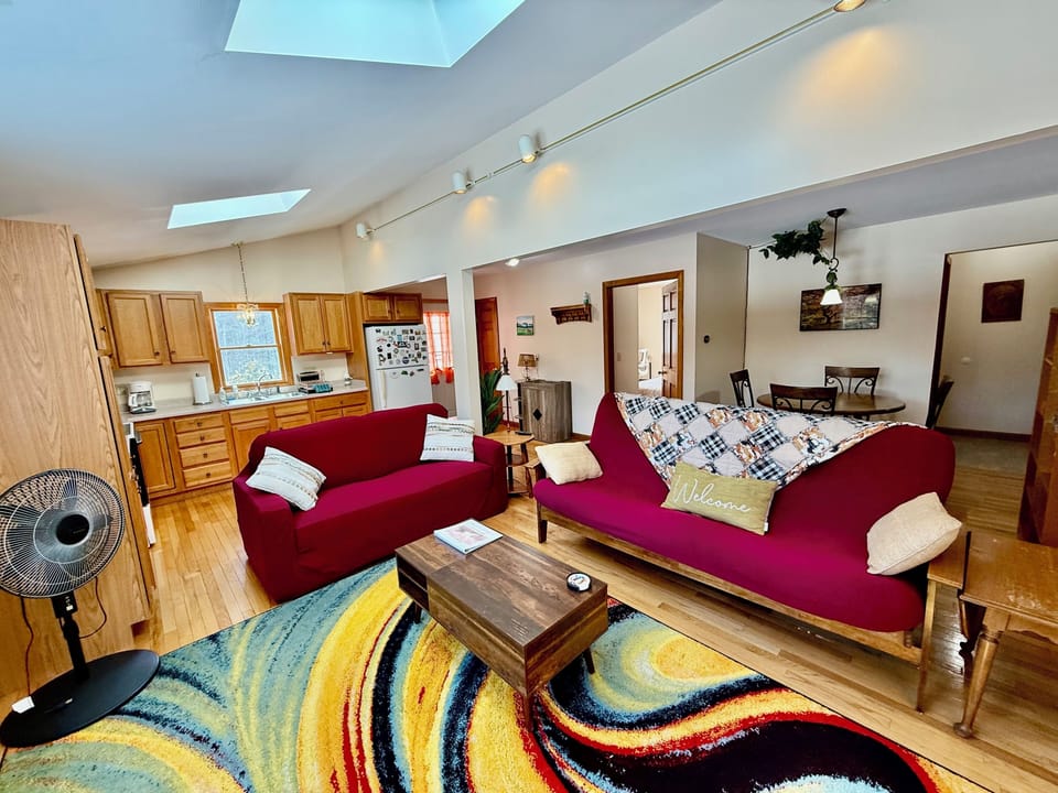 Spacious open floor plan with kitchen, dining room, and living room.