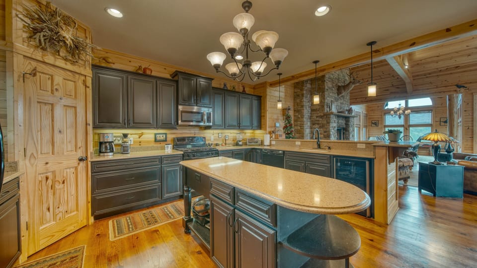 Spacious kitchen with bar stool seating.