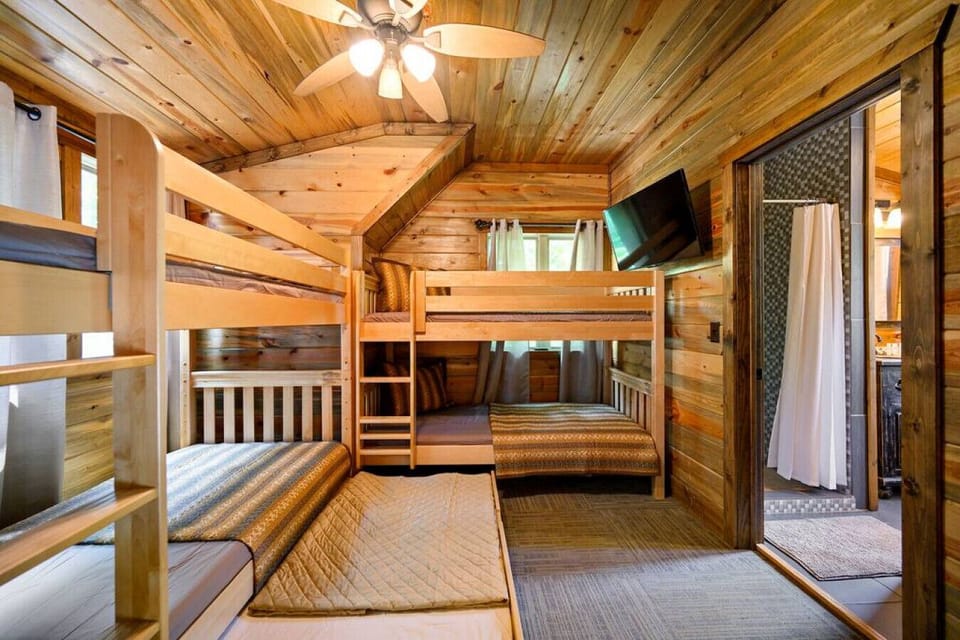 Double the coziness, double the memories – these bunk beds in the cabin are ready to host shared laughter, bedtime stories, and dreams beneath the wooden canopy of adventure.