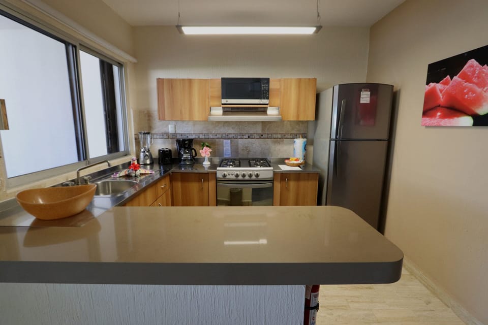 Full-size fridge, microwave, stovetop, toaster