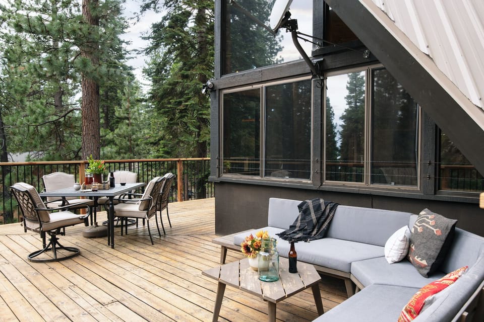 Spacious patio with couch and dining table.