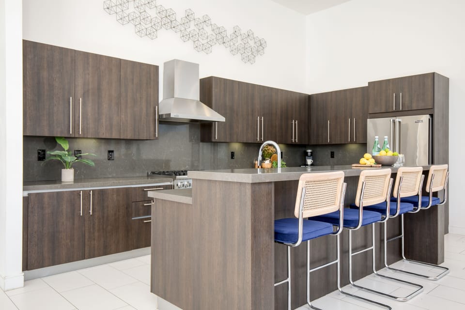Additional barstool seating at the kitchen counter.