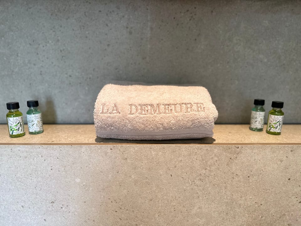 Designer toiletries, hair dryer, towels, soap