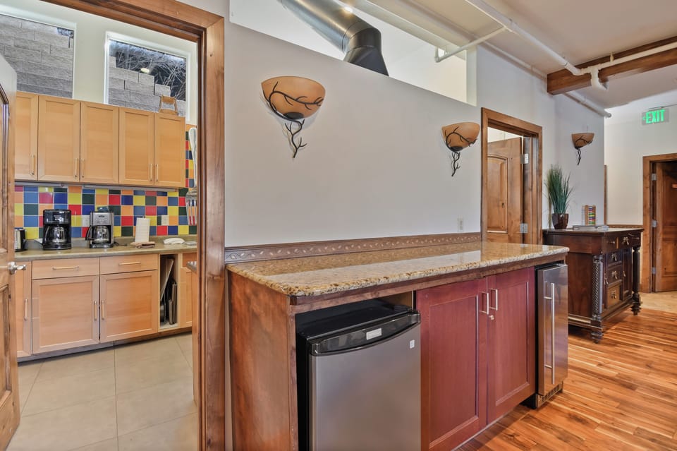 Your stylish kitchen features warm wood cabinets, granite countertops, and stainless steel appliances—perfect for preparing meals during your stay.