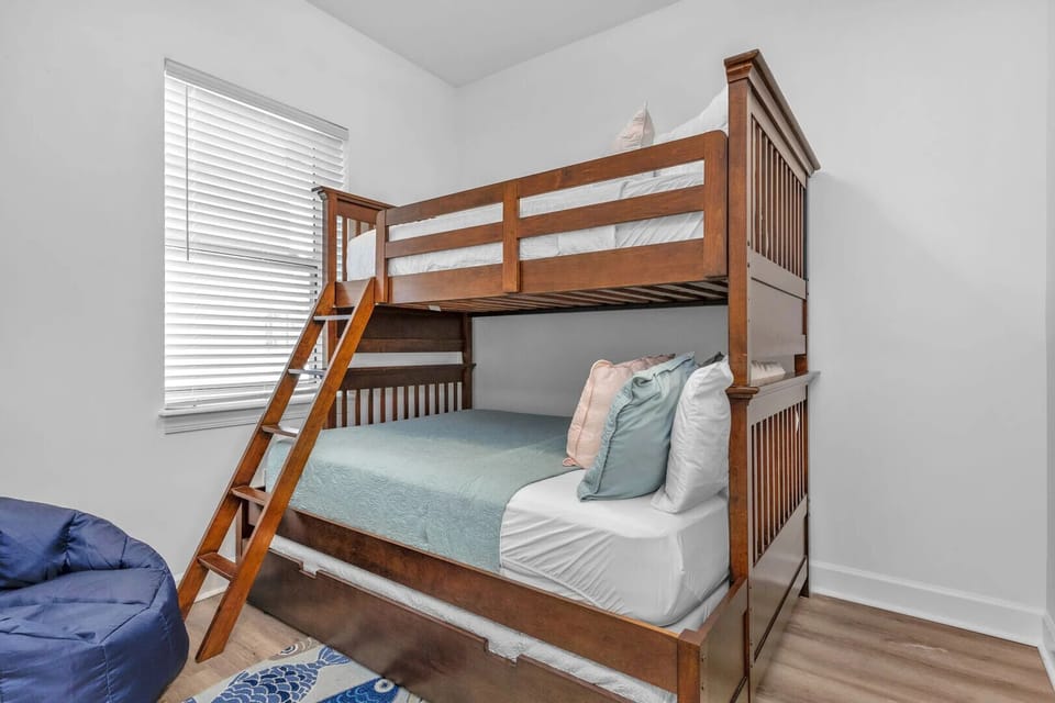 Twin over full bunkbed with twin trundle.