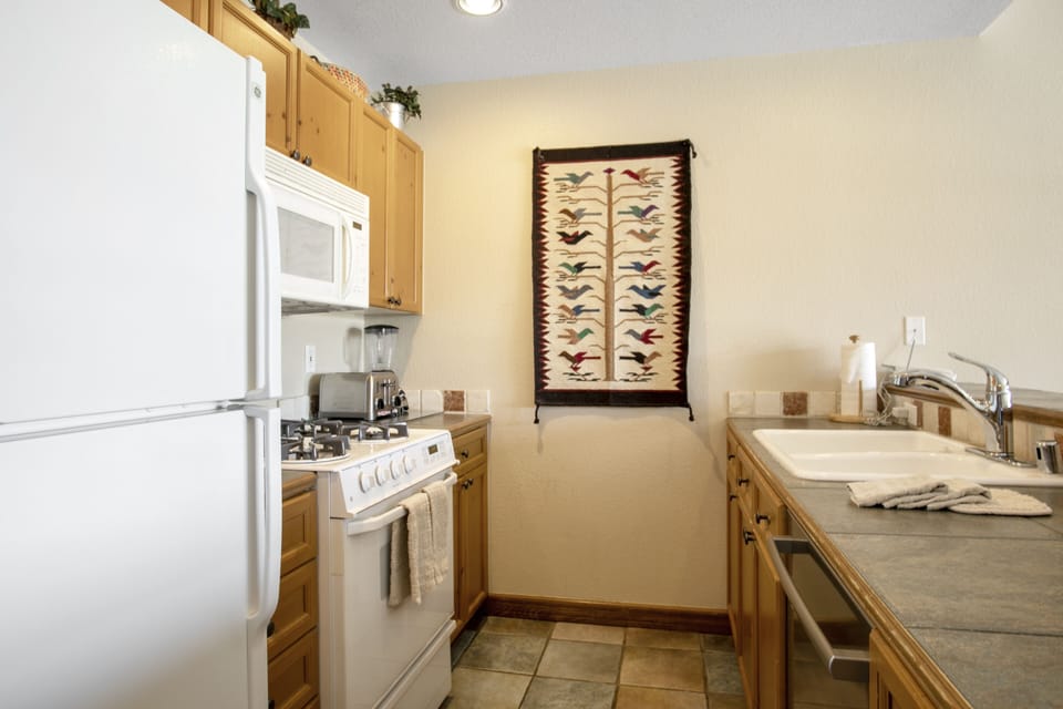 Condo, 2 Bedrooms | Private kitchen | Coffee/tea maker, fridge, oven, toaster