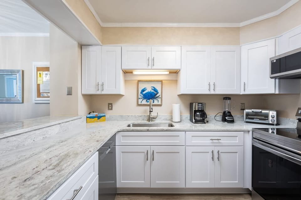 Fully Equipped Kitchen with Refrigerator, Stove, Oven, Microwave, Dishwasher, Coffee Maker and Toaster and Generous Counter Space for Cooking and Entertaining 