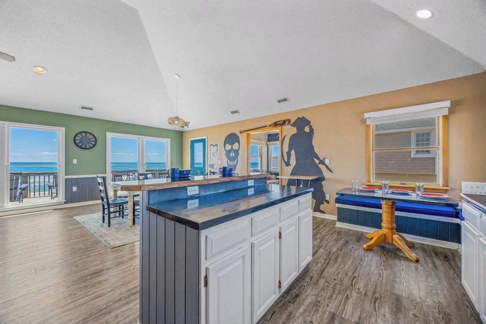 Gather around the spacious island with ocean views through every window. The pirate-themed décor and built-in benches make this your crew's favorite spot for meals and game nights together.