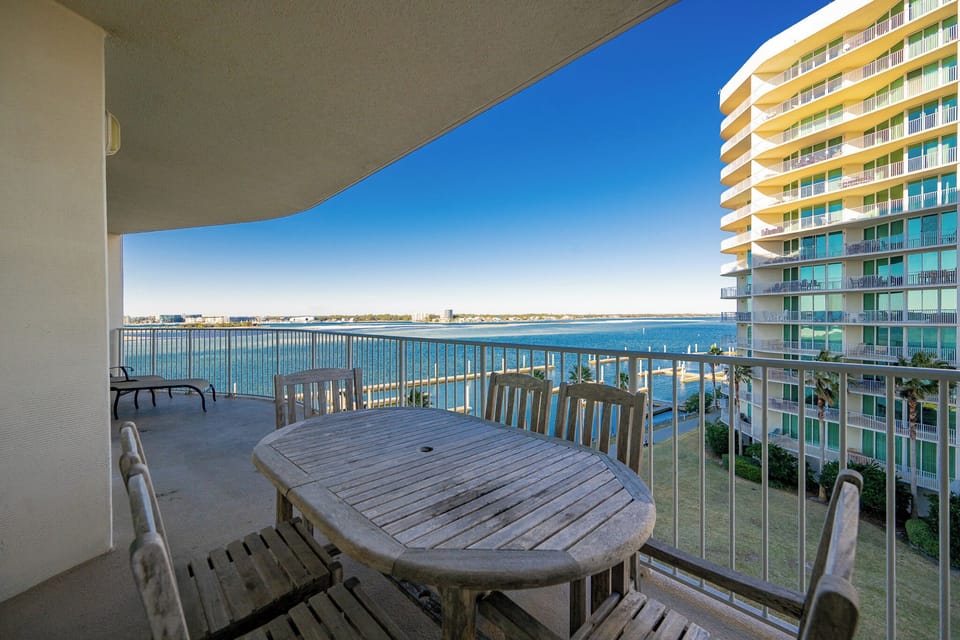 Relax on your balcony with family, soaking in delightful views of the shimmering bay and gentle coastal breeze