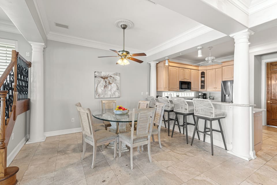 Gather around your elegant dining table or pull up a stool at the kitchen island—this open-concept space invites you to linger over morning coffee and evening conversations.