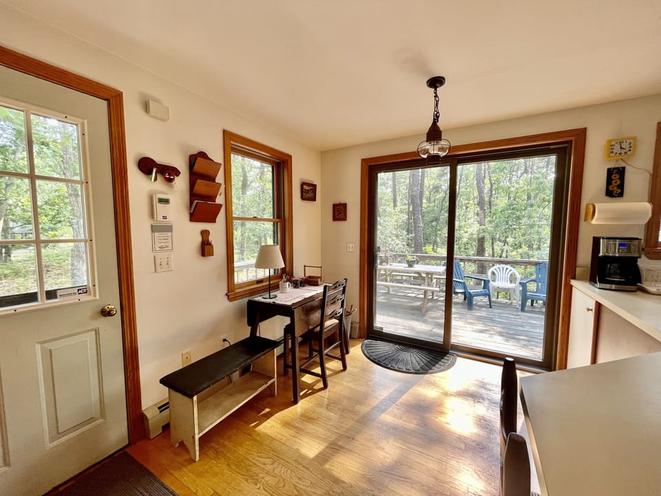 Study/work area with lots of natural light and sliding doors opens to deck.